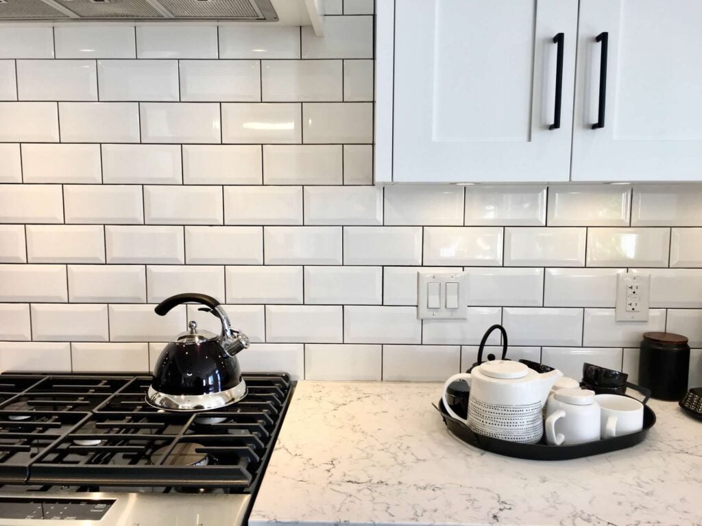 Lay tile in kitchen and backsplash